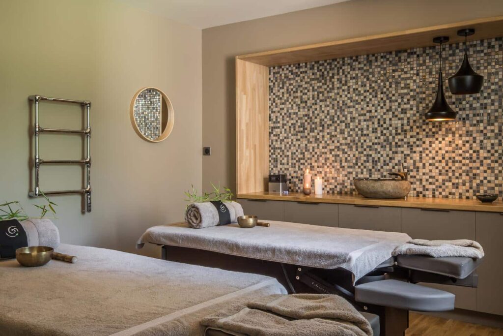Duo treatment room with massage tables and Zen decor at the Bio Spa